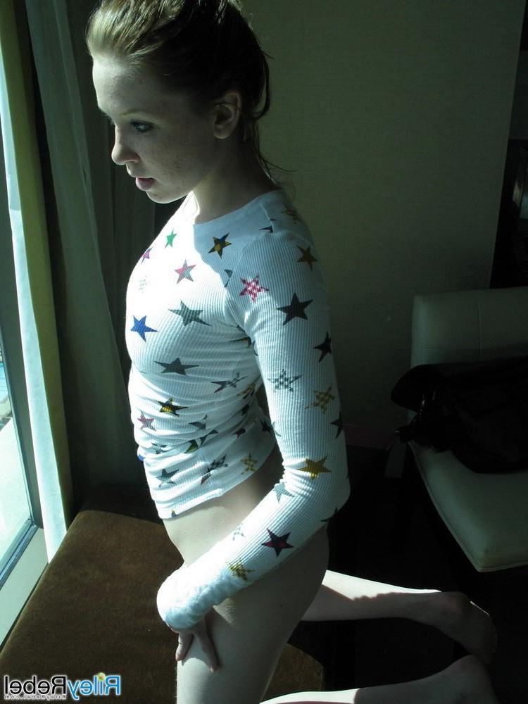 15P Eighteen year old strips in her hotel room window