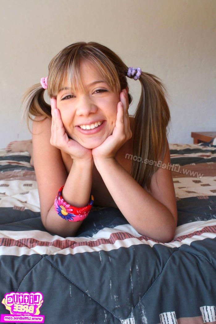 15P Cute teenager in pigtails naked on the bed in a hotel room