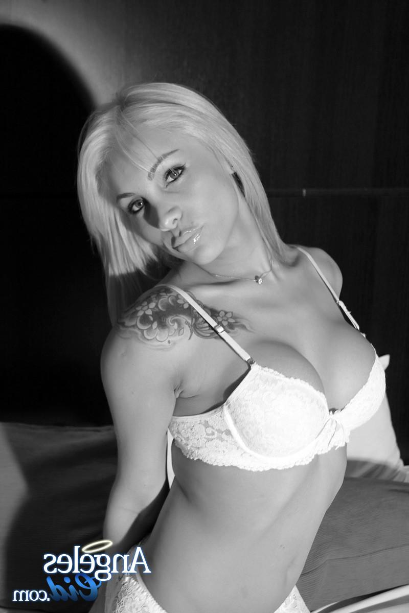 12P TS Angeles Cid in white lingerie lets her gargantuan shecock hang limp and shows
