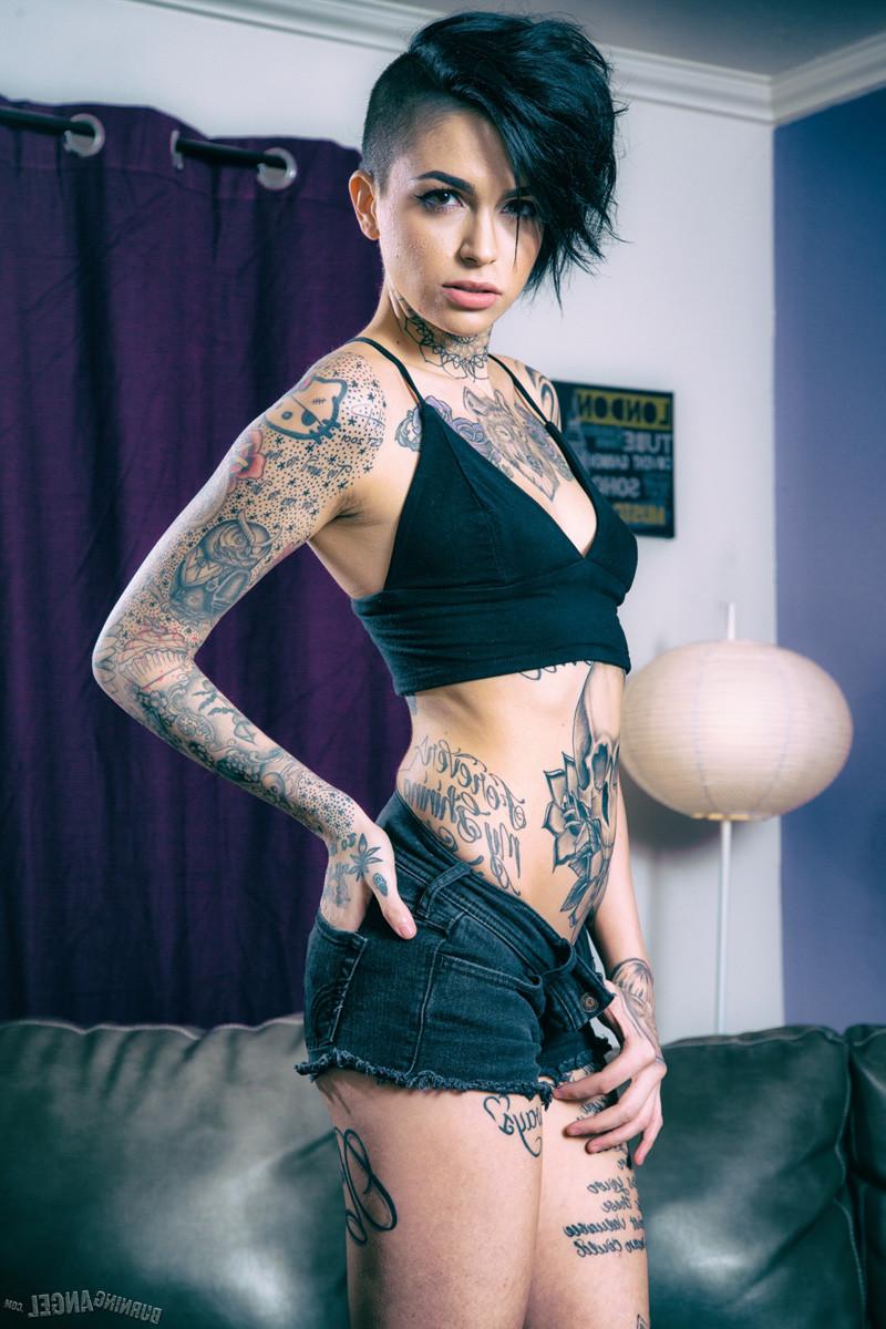 15P Leigh Raven exposes her inked body in the living room