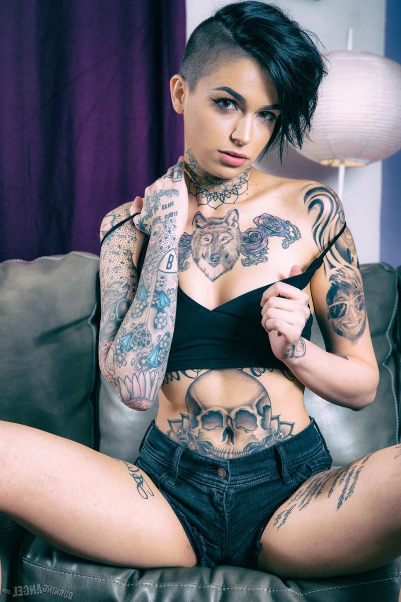 15P Leigh Raven exposes her inked body in the living room