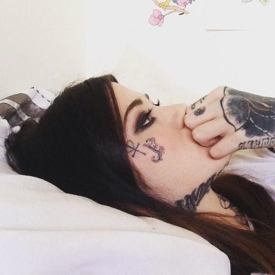 25P Face tattoo women.