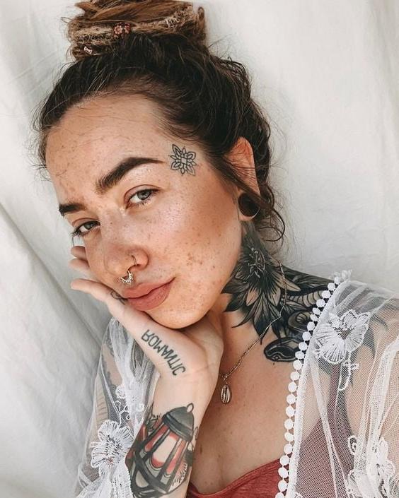 25P Face tattoo women.