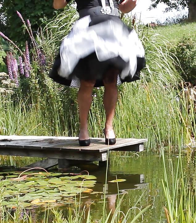 25P Sissy bath fully dressed in a pond, and was observed to