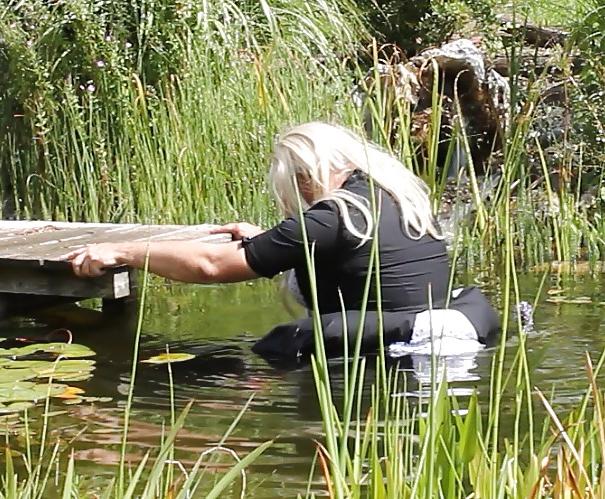 25P Sissy bath fully dressed in a pond, and was observed to