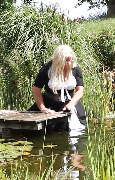 25P Sissy bath fully dressed in a pond, and was observed to