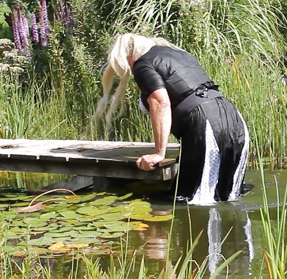 25P Sissy bath fully dressed in a pond, and was observed to