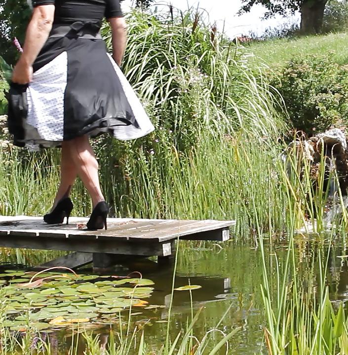 25P Sissy bath fully dressed in a pond, and was observed to