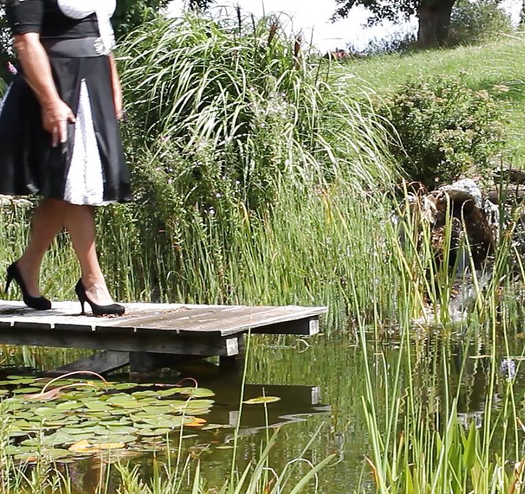 25P Sissy bath fully dressed in a pond, and was observed to