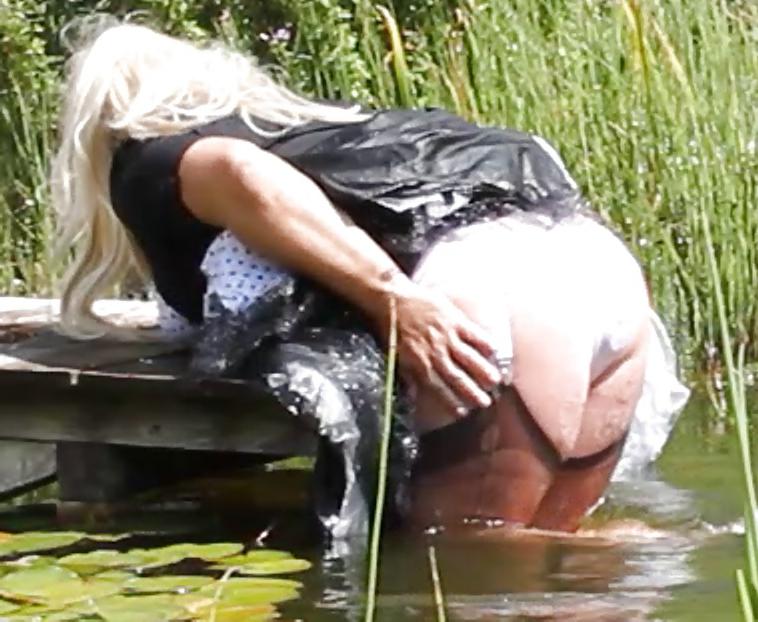 25P Sissy bath fully dressed in a pond, and was observed to