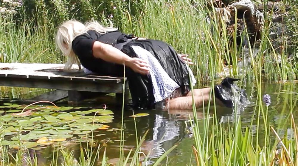 25P Sissy bath fully dressed in a pond, and was observed to