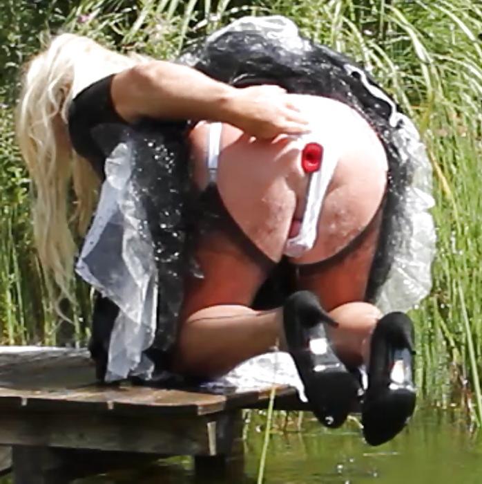 25P Sissy bath fully dressed in a pond, and was observed to