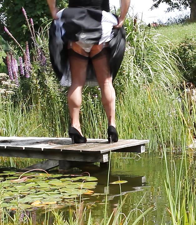 25P Sissy bath fully dressed in a pond, and was observed to