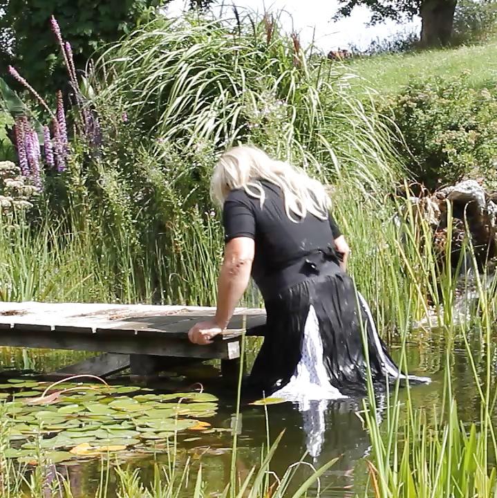 25P Sissy bath fully dressed in a pond, and was observed to