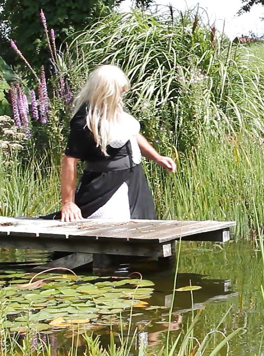 25P Sissy bath fully dressed in a pond, and was observed to
