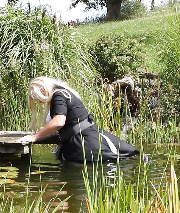 25P Sissy bath fully dressed in a pond, and was observed to