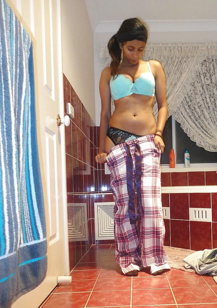 23P A Pakistani chick stripteasing in bathroom - selfshot
