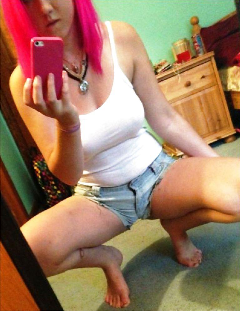 13P Selfshot of a sexy red-haired punk girl with big tits