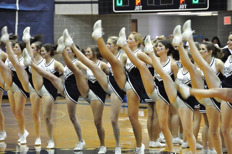 25P Cheerleader cuties with there legs wide apart. 