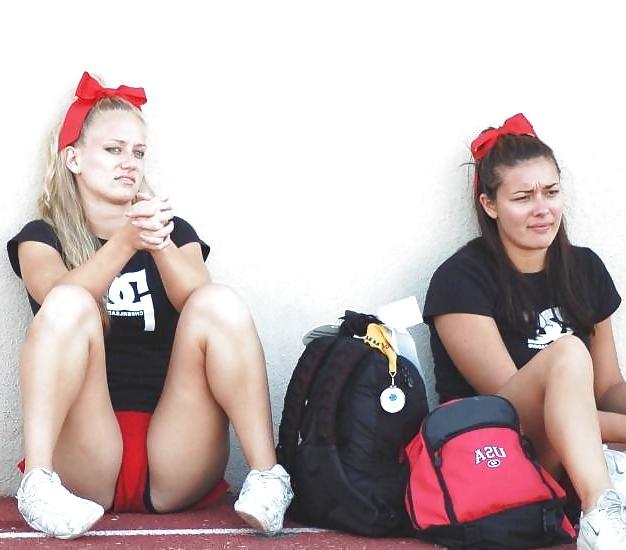 25P Cheerleader cuties with there legs wide apart. 