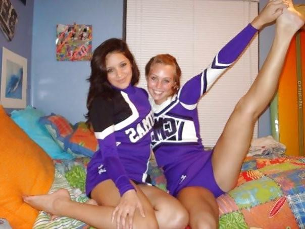 25P Cheerleader cuties with there legs wide apart. 