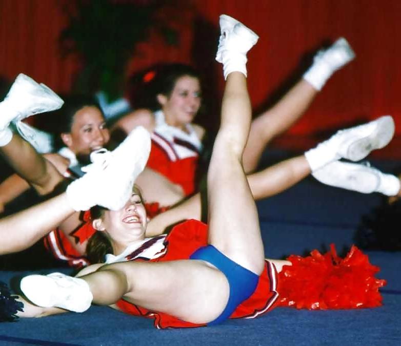 25P Cheerleader cuties with there legs wide apart. 