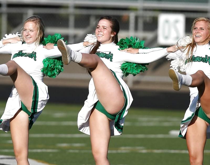 25P Cheerleader cuties with there legs wide apart. 