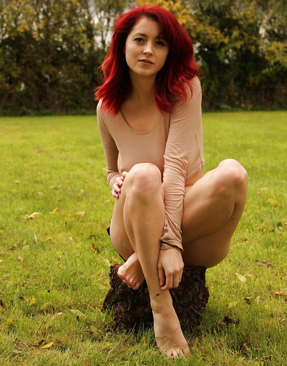 23P Beautiful curvy redhead posing outdoors