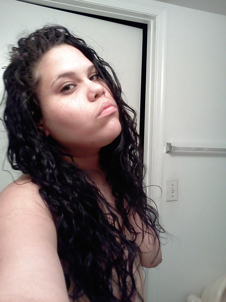 15P Slightly glum girl poses in the bathroom