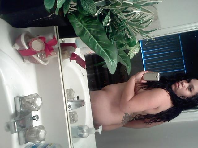15P Slightly glum girl poses in the bathroom