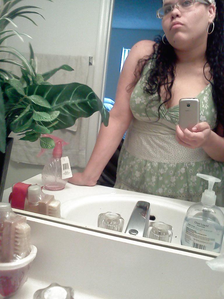 15P Slightly glum girl poses in the bathroom