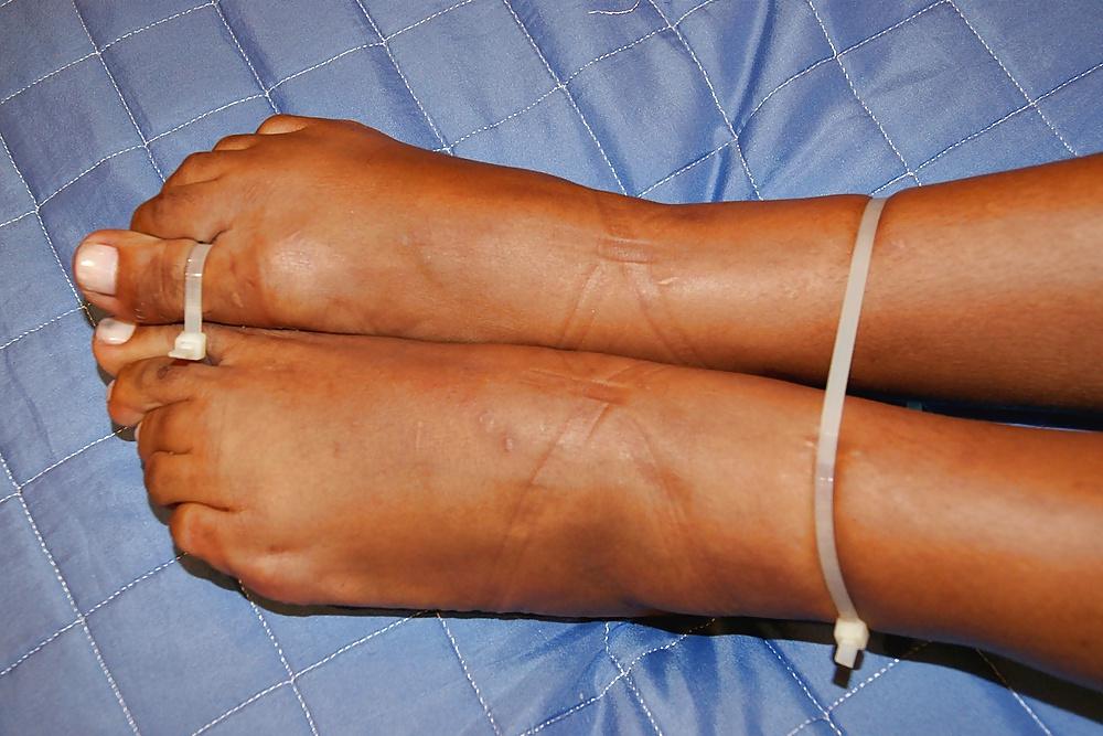 25P Brazilian babe restrained with plastic ties