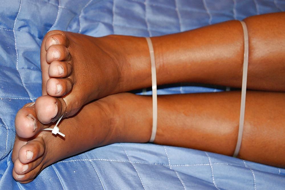 25P Brazilian babe restrained with plastic ties