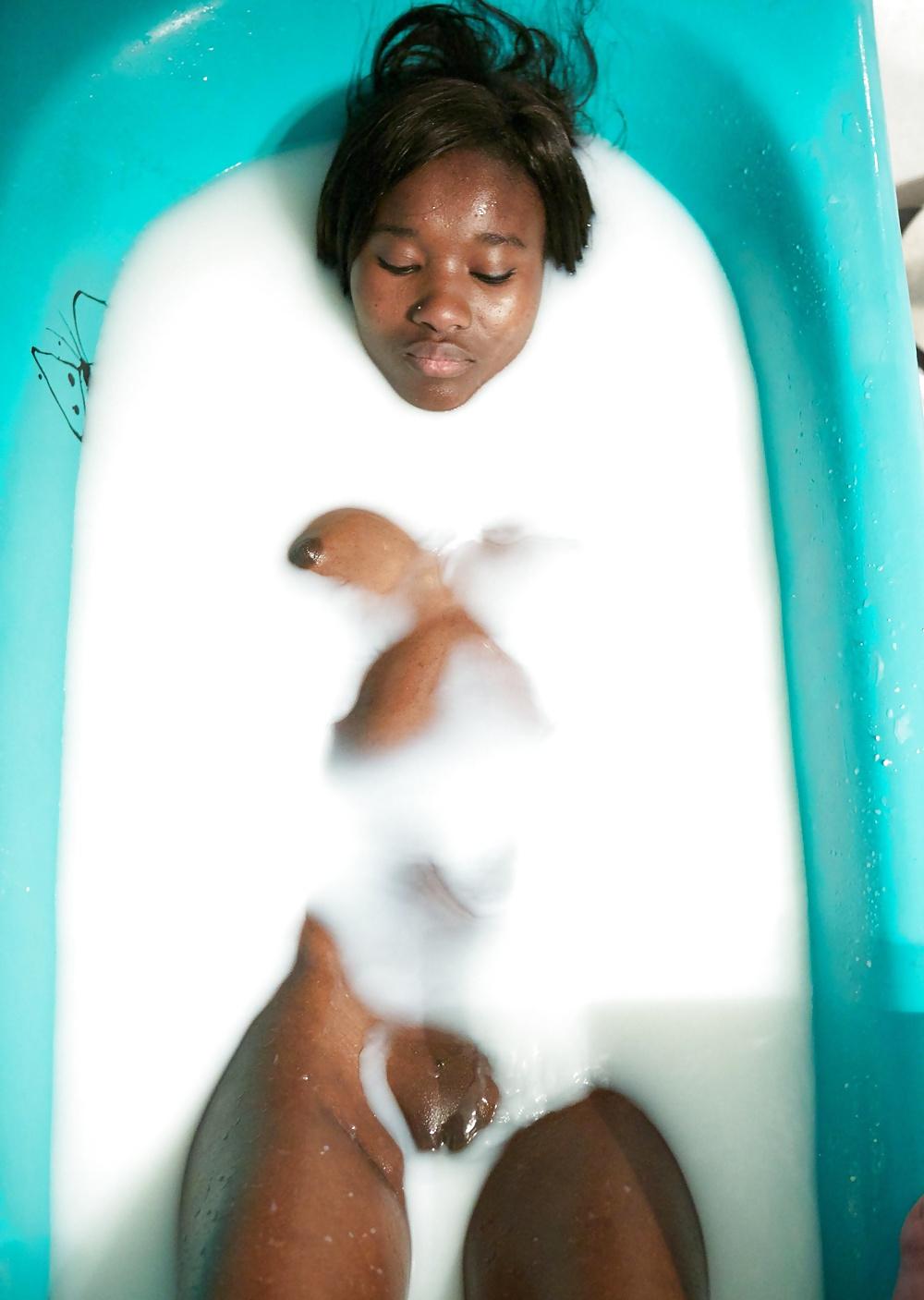 22P Ebony bathing in milk.