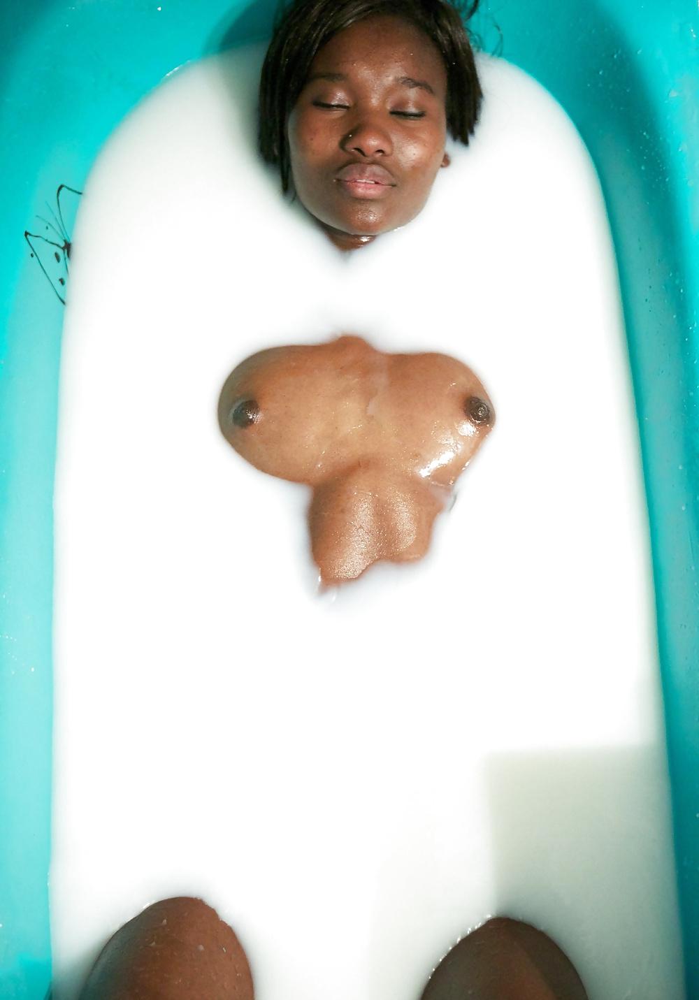 22P Ebony bathing in milk.