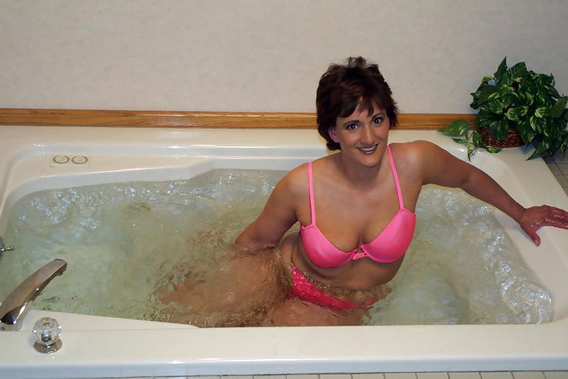 20P Beautiful brunette giving himself a relaxing bath
