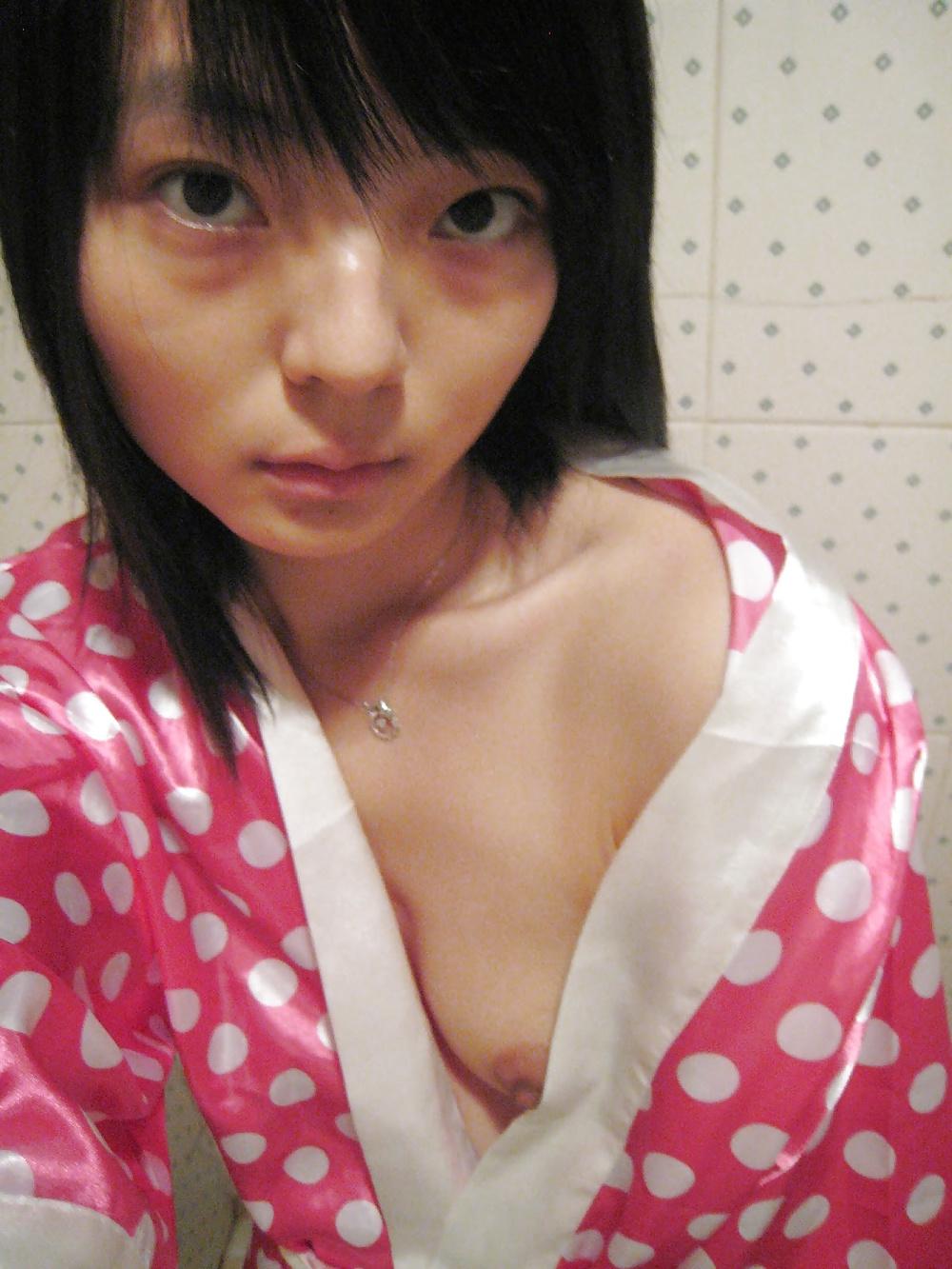 20P Sweet chinese girl shows tits and sucks