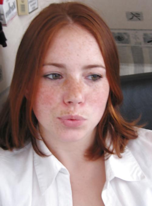 25P Redhead giving blowjob