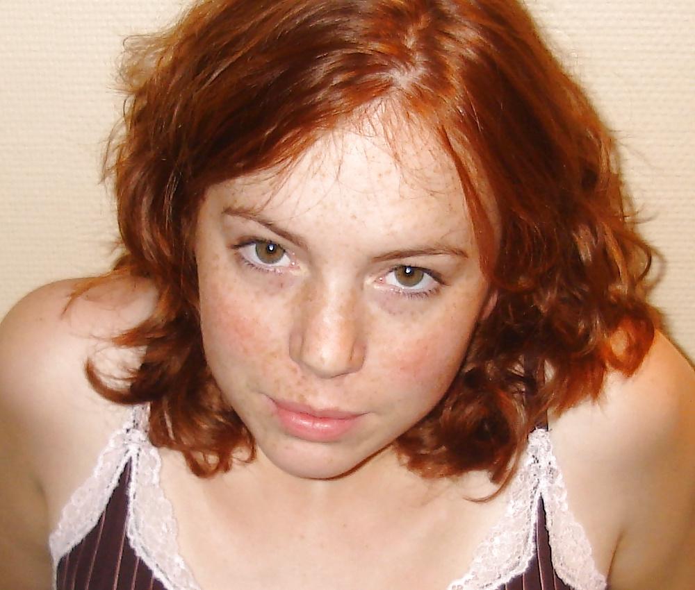 25P Redhead giving blowjob