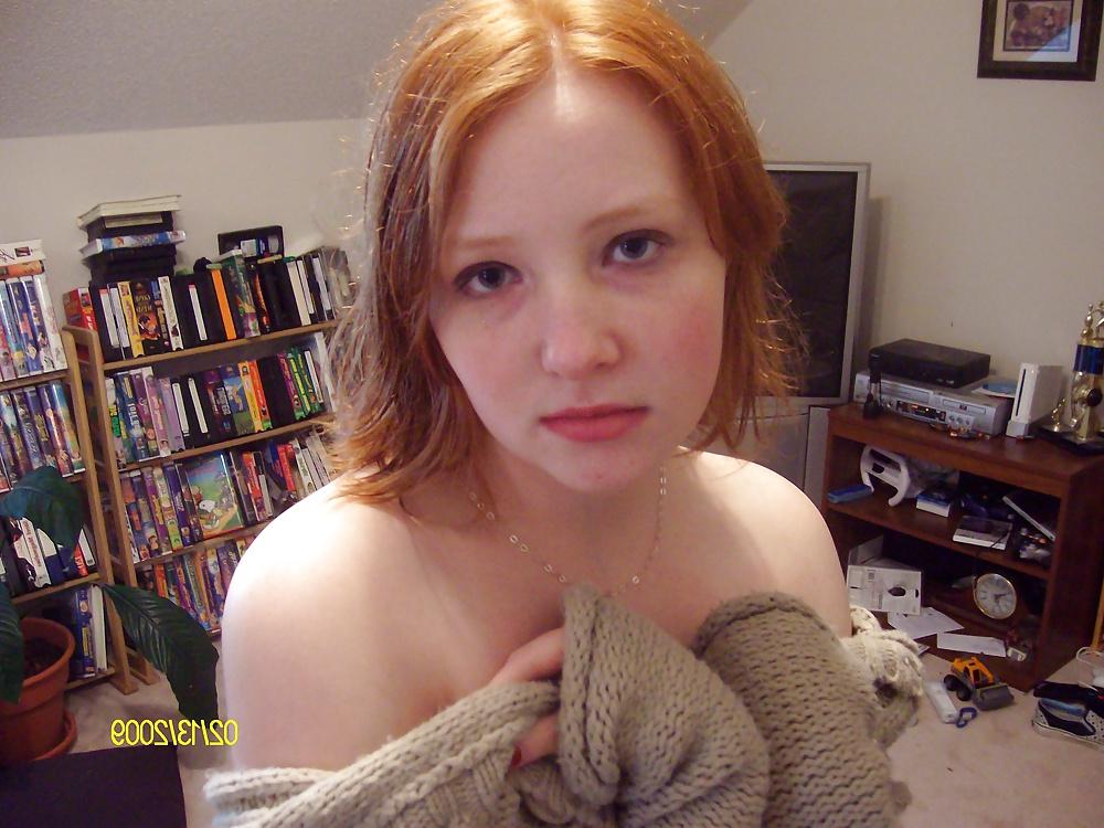 25P Cute Red Head Poses in her Messy Apartment 