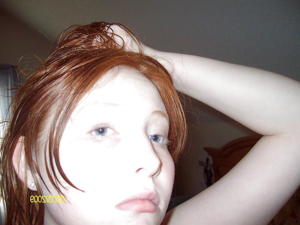 25P Cute Red Head Poses in her Messy Apartment 