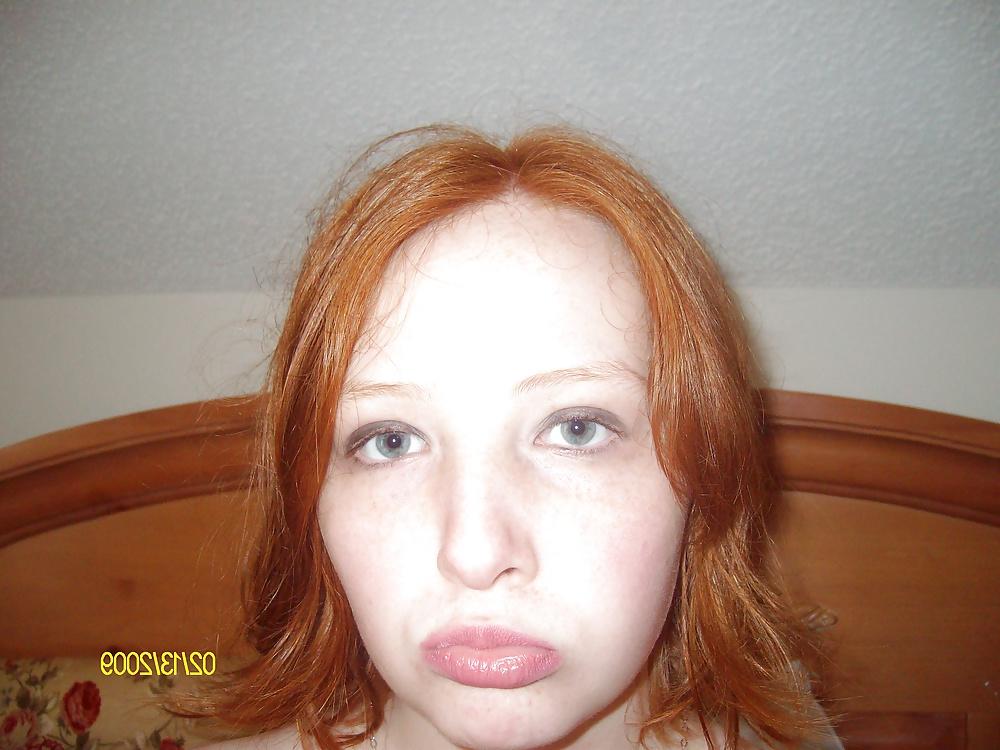 25P Cute Red Head Poses in her Messy Apartment 