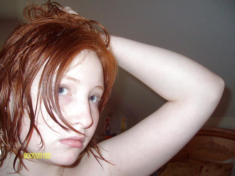 25P Cute Red Head Poses in her Messy Apartment 