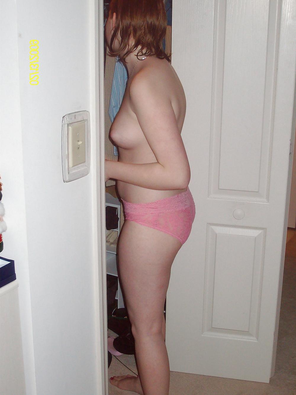 25P Cute Red Head Poses in her Messy Apartment 