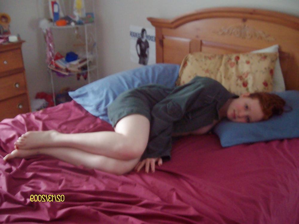 25P Cute Red Head Poses in her Messy Apartment 