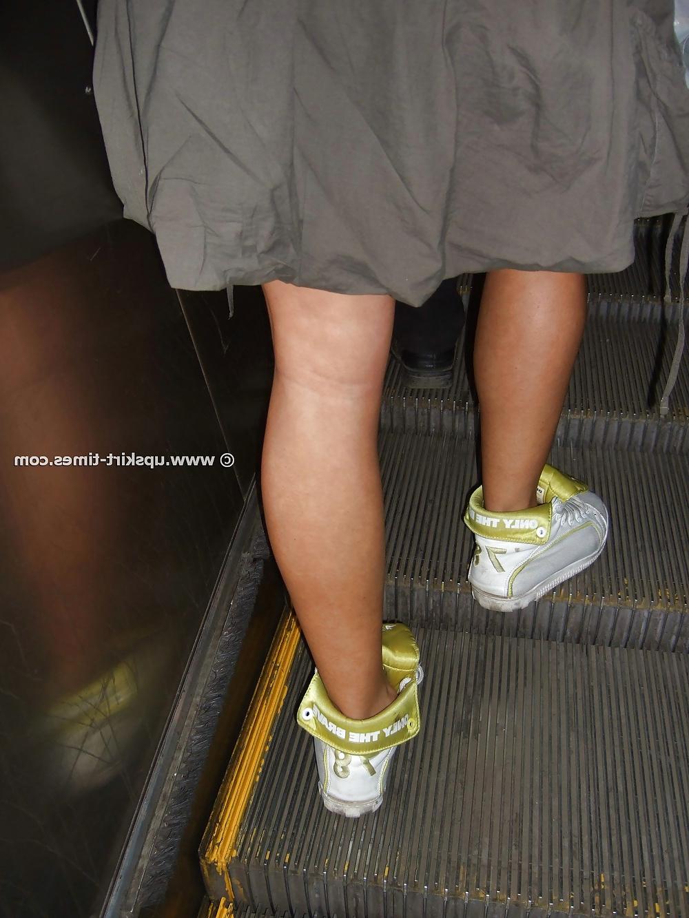 8P Curly girl in a gray skirt