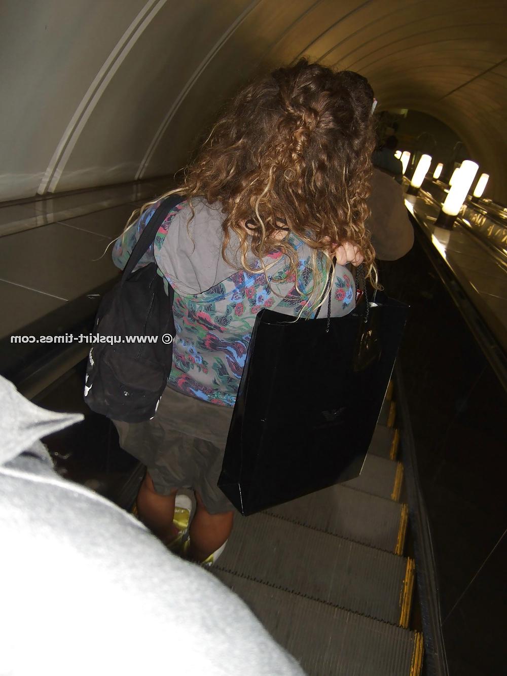 8P Curly girl in a gray skirt