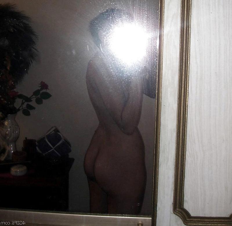 20P Sweet chick in front of a mirror.