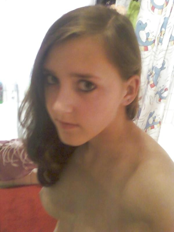 14P Cutie posing in her bathroom