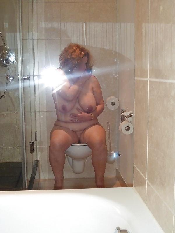 12P Housewife  showing her big breasts in the bathroom